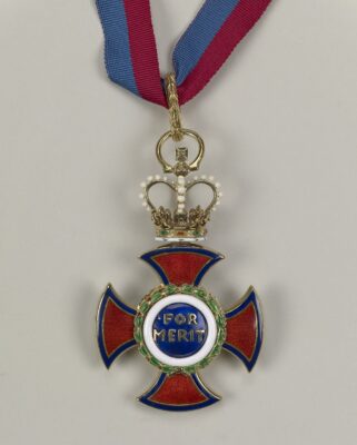 Image of the Red Cross Order of Merit received by Dr. Albert T. W. Simeons